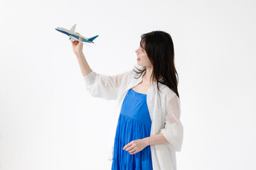 ミドル女性　旅行　飛行機