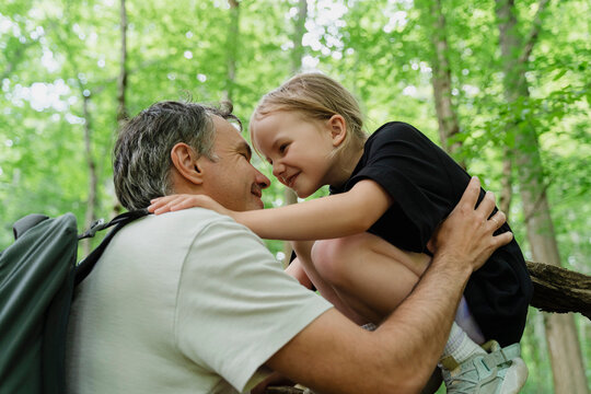 Father and daughter enjoying quality time in a forest