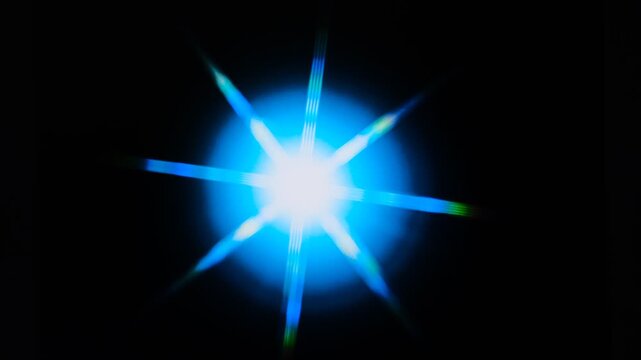 colorful flashy spotlight star made with optical star filter on camera, Surreality abstract motion graphics, vertigo hallucinations induced by stroboscopic flicker