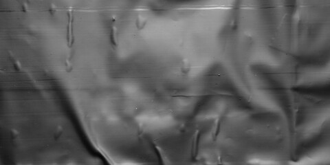 black crumpled and creased plastic bag texture background