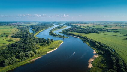 Serpentine river winds through verdant fields