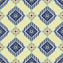 Yellow and blue tribal vector ornament. Seamless African pattern. Ethnic carpet with chevrons. Aztec style. Geometric mosaic on the tile, majolica. Ancient interior. Modern rug. Geo print on textile. 