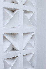 Close Up Of White Concrete Block With Geometric Triangular Design