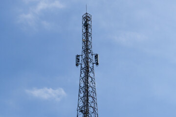 Telecommunication Tower Against Blue Sky Background