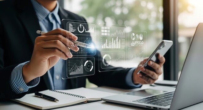 Businessman analyzing financial data on a futuristic holographic interface with a stylus and smartphone