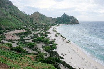 Obraz premium Beautiful view of Cristo Rei Backside Beach or known as Dolok Oan Beach in Dili, Timor Leste. Aerial view of tropical beach.