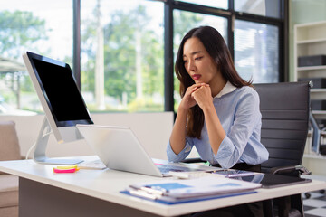 Thinking about how to take the business to technological heights. attractive young businesswoman...