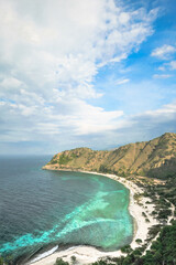 Fototapeta premium Beautiful view of Cristo Rei Backside Beach or known as Dolok Oan Beach in Dili, Timor Leste. Aerial view of tropical beach.