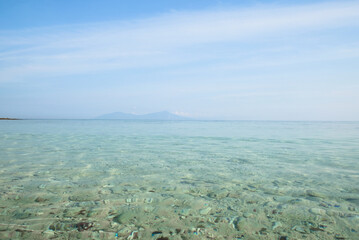 Beautiful view of Cristo Rei Backside Beach or known as Dolok Oan Beach in Dili, Timor Leste. Sea waves background.