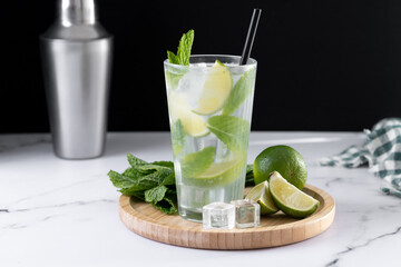 Classic Mojito Cocktail with Lime and Mint on black background. Copy space
