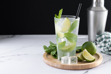 Classic Mojito Cocktail with Lime and Mint on black background. Copy space