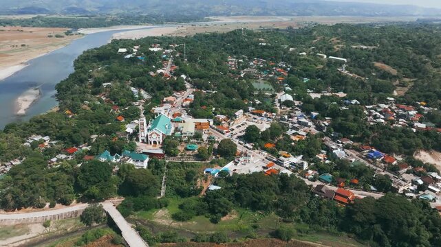 4K Aerial View Of municipality of Piat in Cagayan, Northern Philippines.
the essence of Piat's unique landscape, blending the spiritual significance of its famous basilica with the simple beauty of it