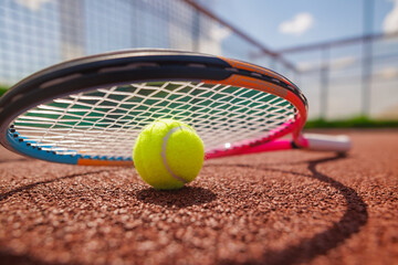 Close-Up of Tennis Ball and Racket on Clay Court During Match