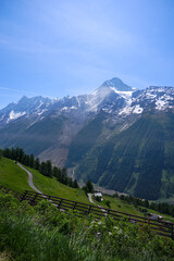 Doing hiking with mountain panorama and avalanche protection in the Swiss Alps at L&ouml;tschental Valley on a sunny late spring day. Photo taken June 19th, L&ouml;tschental Wiler, Switzerland.