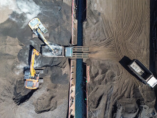 Aerial View of Coal Loading Operation with Excavators and Trucks