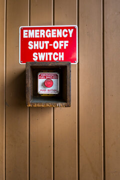 Emergency Shut-off switch at a gas station, red sign and button