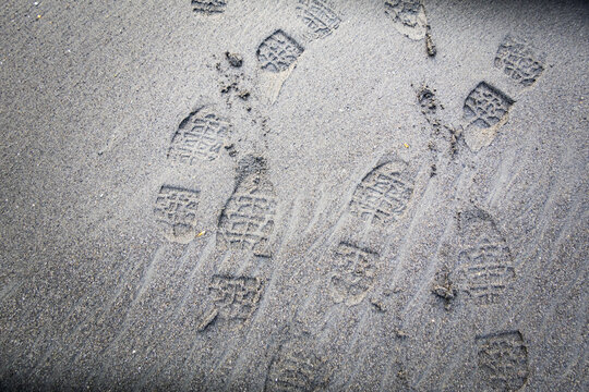 Shoe prints on beach sand, Washington