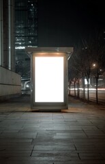 blank billboard with white screen sidewalk night