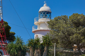 Scenic view of the white lighthouse at Cape Sant Antoni near Xabia, Spain, standing on a cliff...