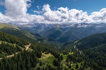 Fototapeta premium Mountain valley panorama. Sunlight on peaks