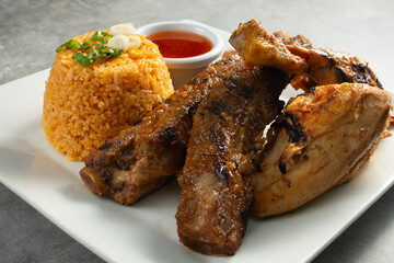 A view of a BBQ pork ribs and chicken.