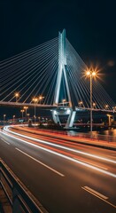 Obraz premium Cable-Stayed Bridge Illuminates Night, Capturing Modern Infrastructure, Light Trails, and Dynamic Urban Transportation Across the Cityscape.