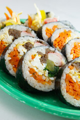 A closeup view of a plate of kimbap.