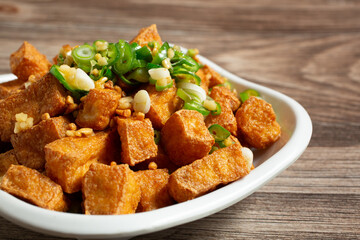 A closeup view of an entree of salt and pepper tofu.