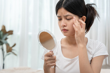 Young woman are worried about faces Dermatology and allergic to steroids in cosmetics. sensitive...