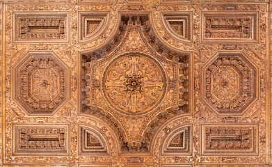 FLORENCE, ITALY - MARCH 17, 2025: The baroque polychrome carved coffered ceiling in the church...