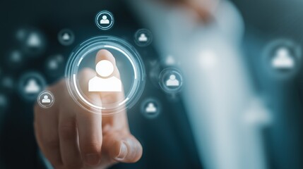 Human Resources at your Fingertips: A close-up of a person's finger touching a virtual interface icon, representing recruitment or HR processes, showcasing digital transformation in the workplace.