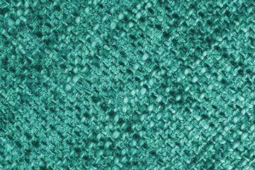 Macro, close up of turquoise woven burlap fabric, cloth texture with thick threads and rough...