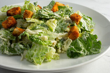 A view of a Caesar salad plate.