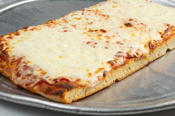A view of a sausage Sicilian pizza.