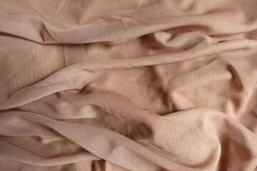 Rumpled pastel beige unprinted polyester mesh fabric