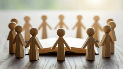 Group of wooden figures holding hands in a circle around Bible — unity in faith and prayer