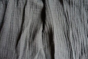 simple dark grey cotton muslin fabric in soft folds