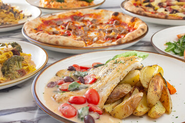A view of several Italian entrees, as a group.
