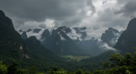 Fototapeta premium Monsoon clouds rolling over Hin Nam No mountain range
