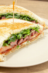 A closeup view of a steak sandwich.