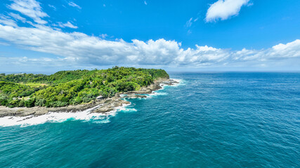 Tropical Island with Cliff Shore and Calm Water
