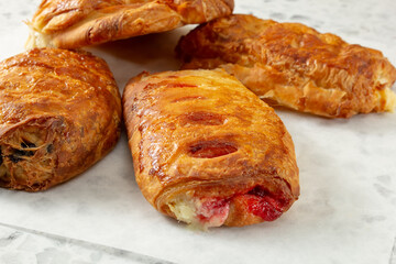 A closeup view of a pile of assorted pastries.