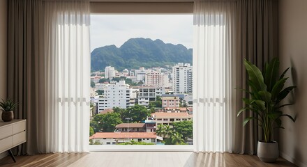 Modern interior room with panoramic city and mountain views through sheer curtains.