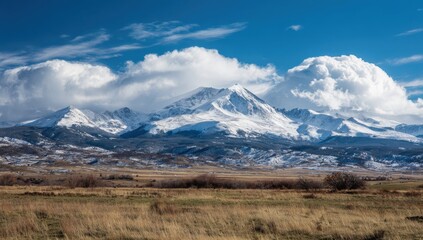 Snowy mountain range under dramatic sky (1)
