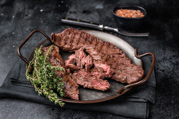 Grilled Beef Machete Skirt Steak, prime meat. black background. top view