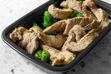 A view of a container of beef broccoli.