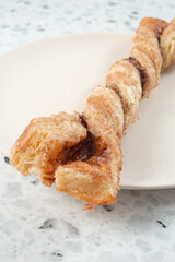 A view of a cinnamon puff donut.