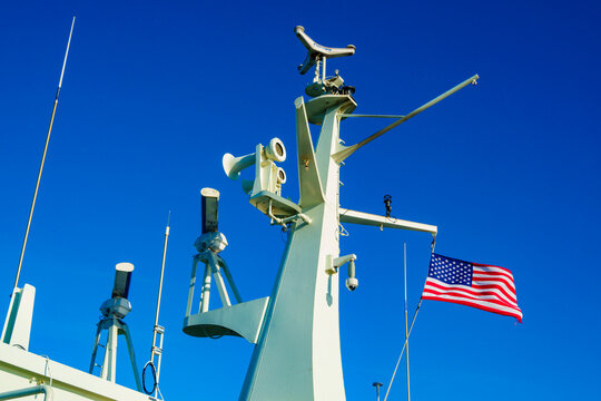 Kingston to Edmonds ferry, view of the communications tower and American flag flying.