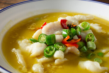 A closeup view of a Chinese fish soup.