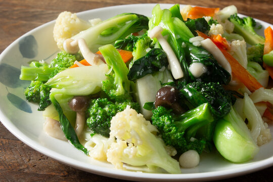 A closeup view of a plate of stir fry mixed vegetables.